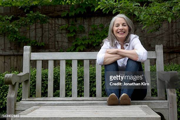 senior woman in garden - real estate fotografías e imágenes de stock