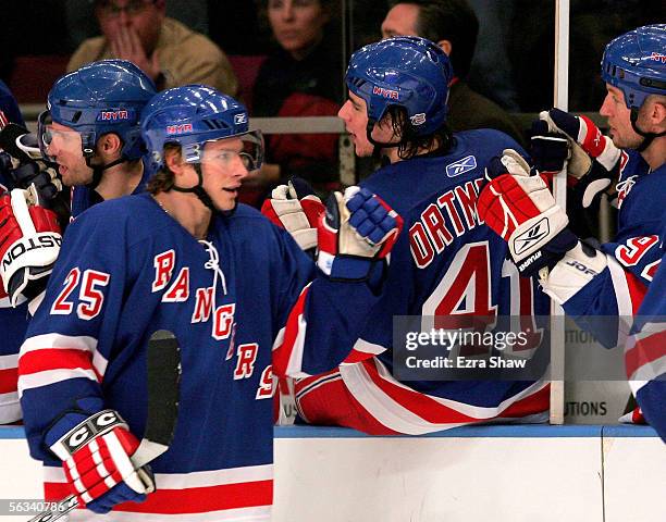 Petr Prucha of the New York Rangers is congratulated by teammates after he scored a goal to put the Rangers up 2-1 over the Minnesota Wild in the...