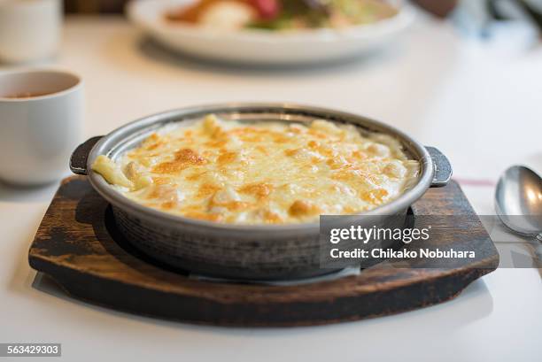 seafood gratin - man made age stock pictures, royalty-free photos & images