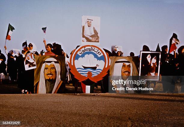 Demonstration in Kuwait, following the country's invasion by Iraq at the start of the Gulf War, 4th-6th August 1990. In the centre is the Emblem of...