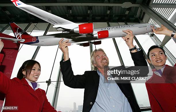 British tycoon and Virgin Atlantic boss Richard Branson poses for a photo following a press conference in Hong Kong, 06 December 2005. Branson...