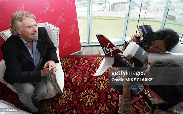 British tycoon and Virgin Atlantic boss Richard Branson poses for the press during a press conference in Hong Kong, 06 December 2005. Branson...