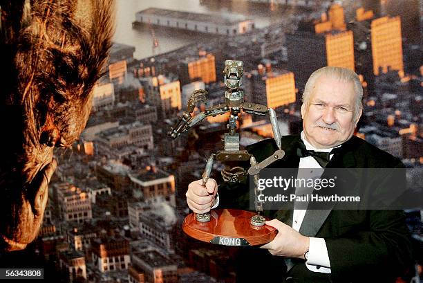 Prop historian Bob Burns holds the original King Kong stop-motion skeleton from the 1933 movie as he attends the Universal Pictures' premiere of...