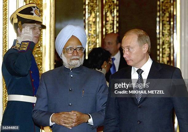 Moscow, RUSSIAN FEDERATION: Russian President Vladimir Putin and Indian Prime Minister Manmohan Singh walk during thieir meeting at Moscow's Kremlin,...