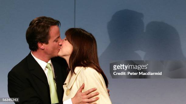 Newly elected leader of the Conservative Party David Cameron kisses his wife Samantha after giving his acceptance speech on December 6, 2005 in...
