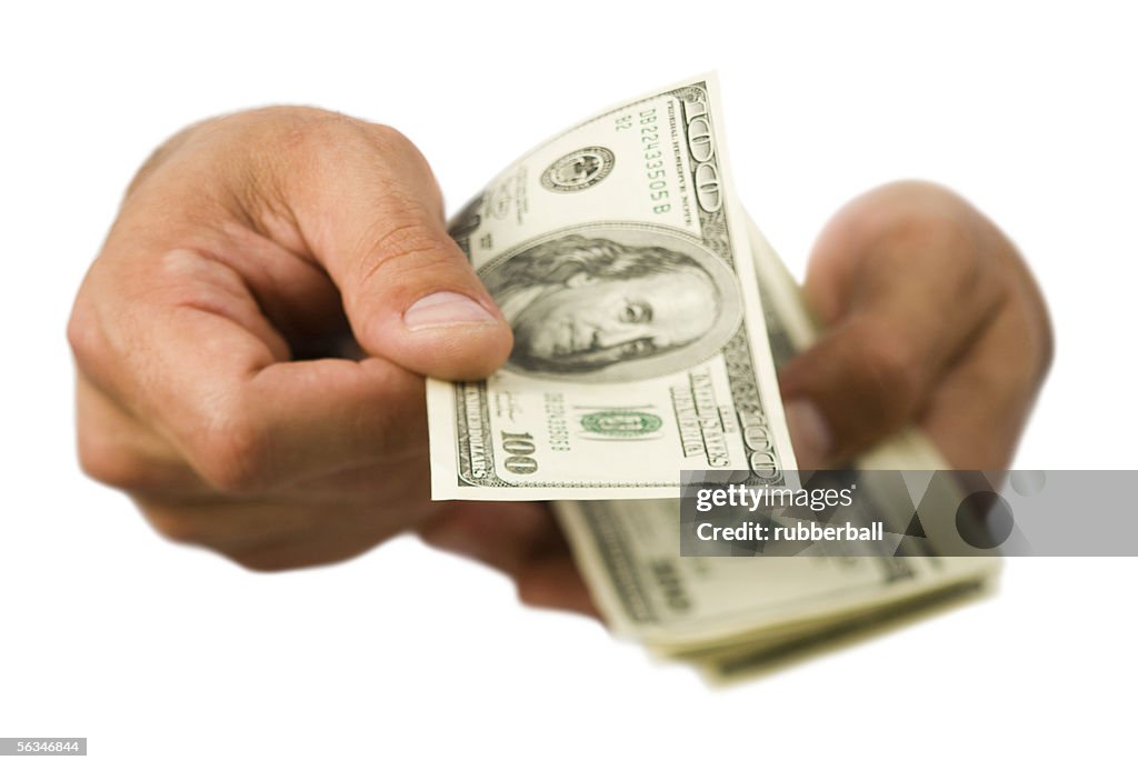 Close-up of hands holding money