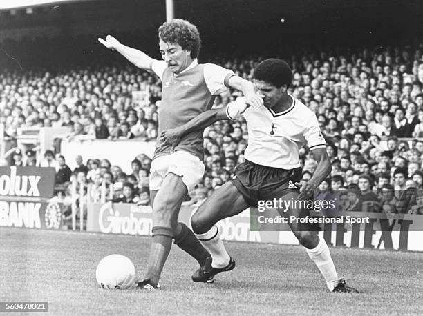 Arsenal Football Club striker Alan Sunderland holds off a challenge from Tottenham Hotspur full-back Chris Hughton during a First Division match at...