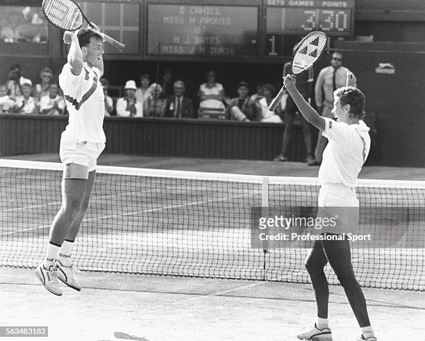 British tennis players Jeremy Bates and Jo Durie celebrate after winning the match point in the mixed doubles final at Wimbledon Tennis Championships...