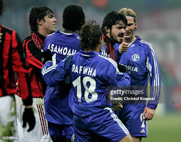 Christian Poulsen of Schalke clashes with Gennaro Gattuso of Milan after the UEFA Champions League Group E match between AC Milan and Schalke 04 at...