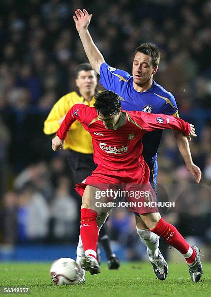 London, UNITED KINGDOM: Chelsea's captain John Terry tackles Luis Garcia of Liverpool during their Champions League game at Stamford Bridge in...