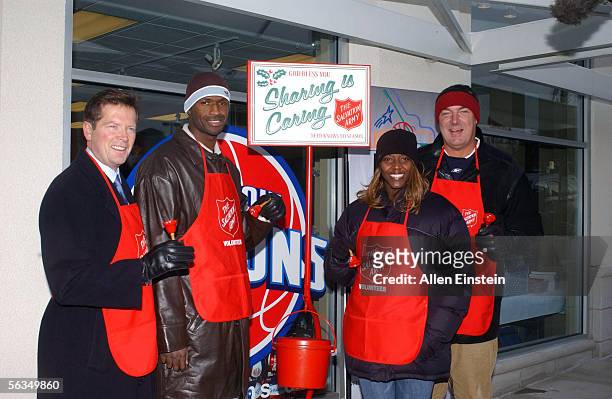 Tom Wilson, Palace Sports President and CEO, Antonio McDyess of the Detroit Pistons, Barbara Farris of the Detroit Shock, and head coach Bill...