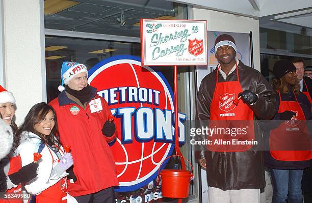 Antonio McDyess of the Detroit Pistons rings a Salvation Army Bell during the Red Kettle holiday campaign outside the Palace Locker Room Store on...