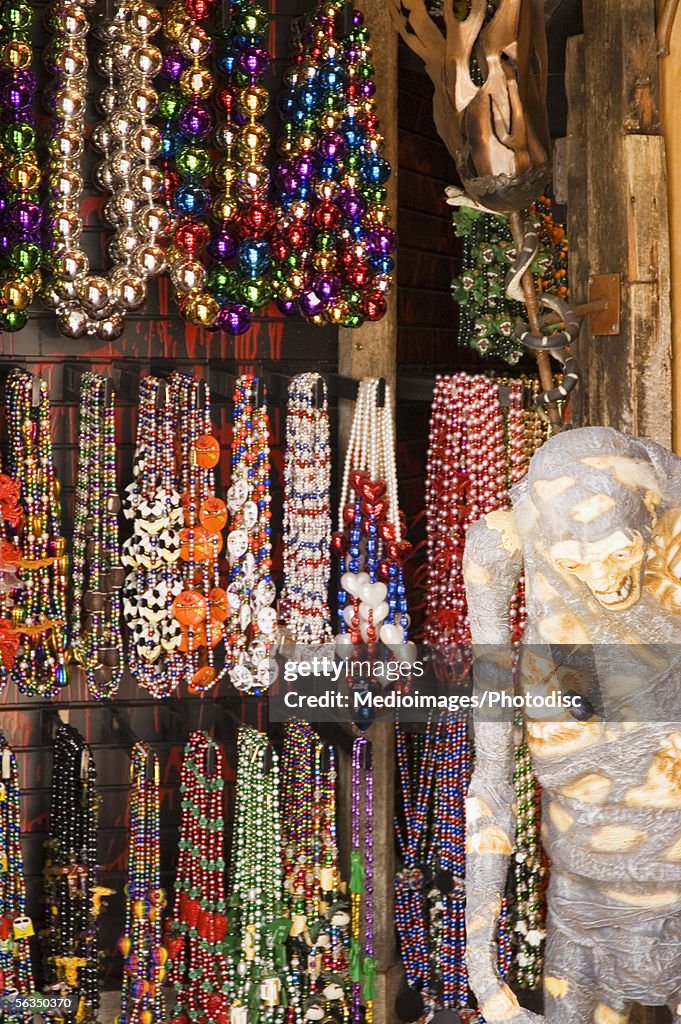 Mardi Gras beads hanging in market stall