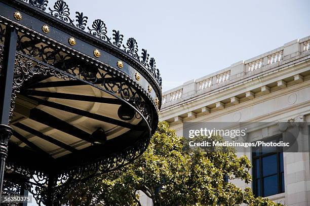 hotel awning in french quarter, low angle view - new orleans architecture stock pictures, royalty-free photos & images