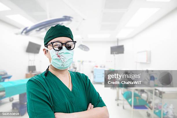 asian young surgeon - surgical loupes stock pictures, royalty-free photos & images