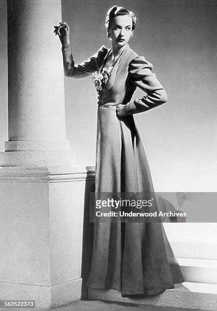 Fashion model from Robert Piguet fashion house wearing a summer evening frock with transparent taffeta overcoat, Paris, France, July 8, 1936.