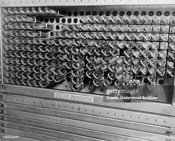 Tubes and electrical connections inside an early computer or business machine, Cleveland, Ohio, circa 1952.