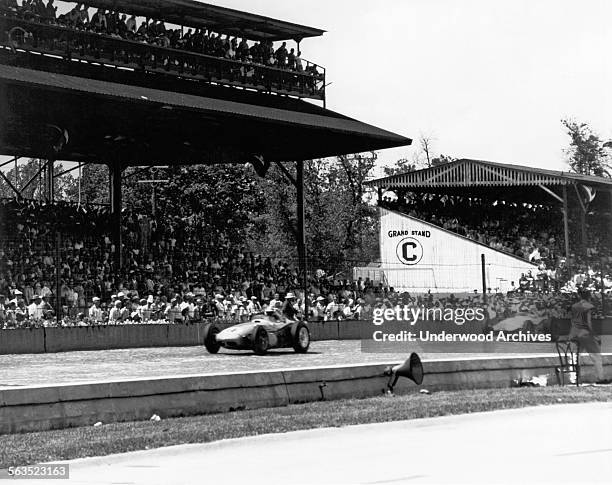 Race car driver Jim Rathman on the brick main stretch at the Indianapolis 500 race track, Indianapolis, Indiana, May 1960.