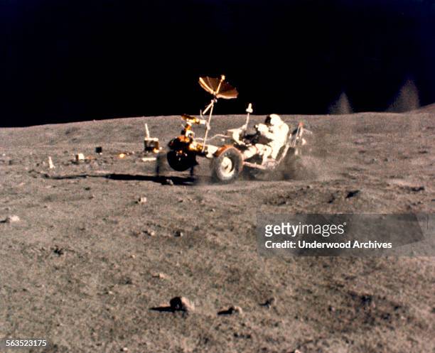Astronaut John Young gives the Lunar Roving Vehicle a speed workout in the 'Grand Prix' run during the third Apollo 16 extravehicular activity at the...