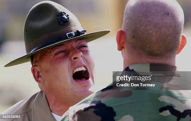 Drill Instructor Stf. Sgt. Justin McCormick puts his recruit through the paces at the Marine Corps Recruit Depot in San Diego. The Marine Corps has...