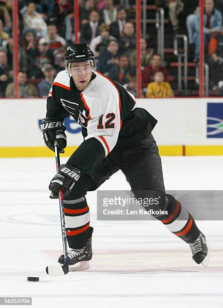 Simon Gagne of the Philadelphia Flyers controls the puck during the game against the New Jersey Devils at the Wachovia Center on November 30,2005 in...