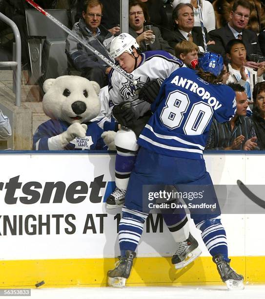 Nik Antropov of the Toronto Maple Leafs checks Joe Corvo of the Los Angeles Kings on December 6, 2005 at the Air Canada Centre in Toronto, Ontario,...