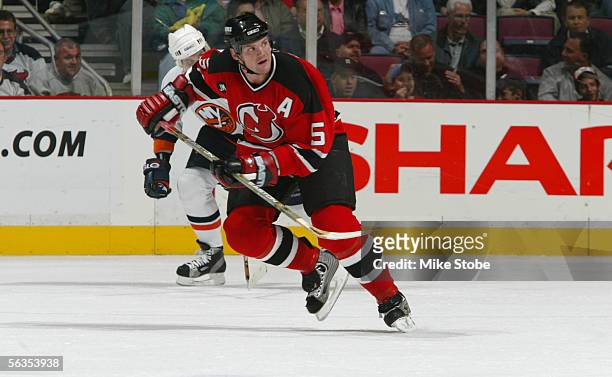 Defenseman Colin White of the New Jersey Devils skates against the New York Islanders at Continental Airlines Arena on November 8, 2005 in East...