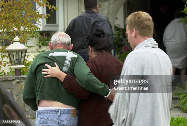 Family members return to a neighbor's home from hospital after getting treated for the injuries caused in an attack by Eric Kiefer. Eric Kiefer broke...