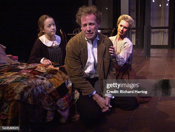 Geoff Elliott as Hjalmar Ekdal, center, with Lily Nicksay as Hedvig, left, and Julia Coffey as Gina Ekdal, right, during a scene from The Wild Duck,...