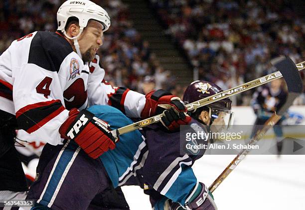 New Jersey Devils center Scott Stevens checks Anaheim's Paul Kariya in the second period of game five of the Stanley Cup Finals, Thursday, June 5,...