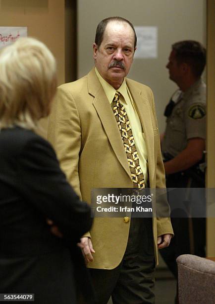 James Lee Crummel center, walks into Riverside County court, where he was sentenced to death Monday by a jury. Crummel, described by prosecutors as a...