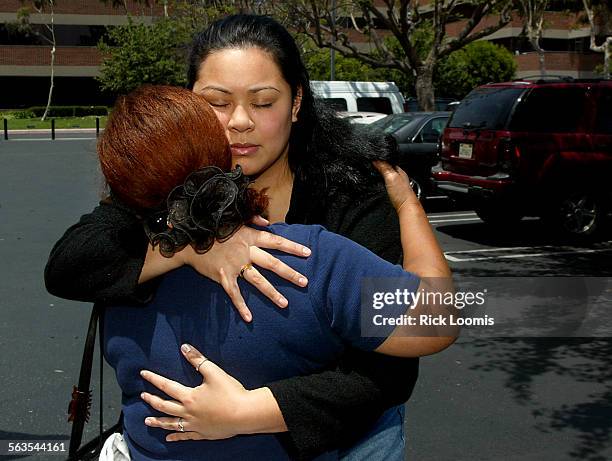 Santa AnaElizabeth Uhrle, niece of Peter Solomona, hugs Masele Broderson , sister of Peter Solomona, after Solomona was convicted of voluntary...