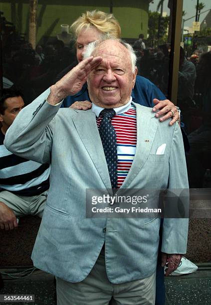 Legendary actor Mickey Rooney salutes as the intersection of Hollywood and Vine was designated as "Bob Hope Square." This was to mark the occasion of...