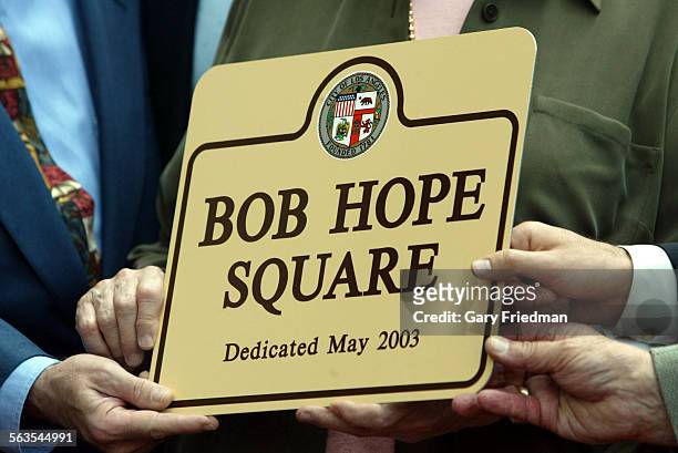 The 2 sons and daughter of Bob Hope holds a commemorative plaque which designated the intersection of Hollywood and Vine was as "Bob Hope Square."...