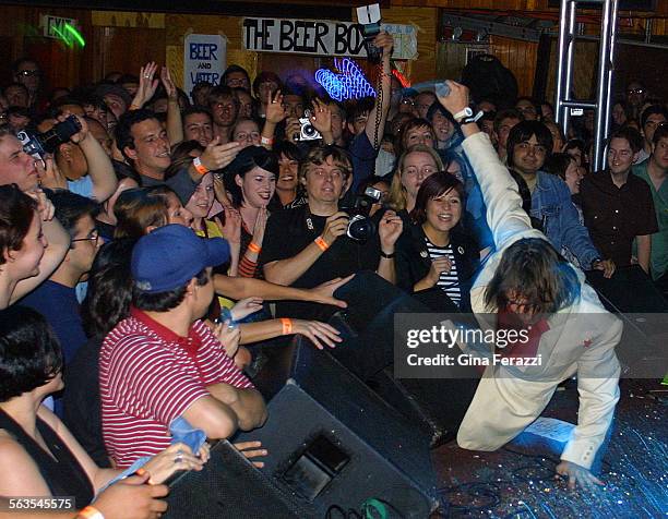 Lead singer for The Strokes Julian Casablanca falls into the crowd while performing at the Troubadour in Hollywood on Friday.