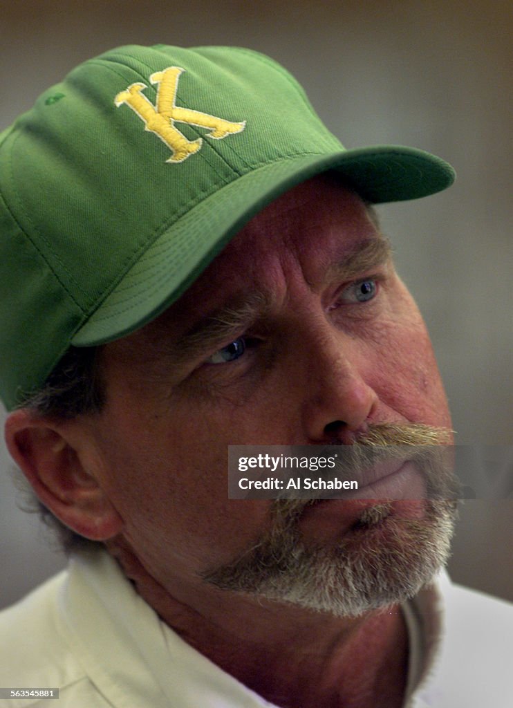 Jon Ketsdever(CQ), father of shooting victim Brandon Ketsdever(CQ), wears a baseball cap from John F