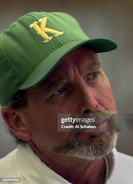 Jon Ketsdever, father of shooting victim Brandon Ketsdever, wears a baseball cap from John F. Kennedy High School his son gave him before he died, as...