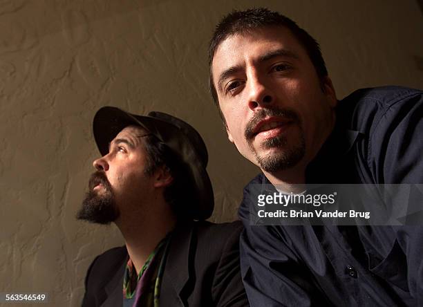 Nirvana members Krist Novaselic and Dave Grohl are photographed for Los Angeles Times on December 7, 2001 in Los Angeles, California. PUBLISHED...