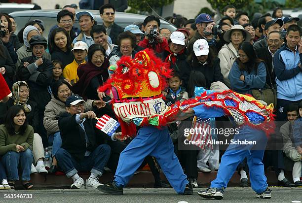 Members of Vovinam Viet Vo Dao vietnamese martial arts group of Westminster, perform the dragon dance for good luck during the Tet parade new years...