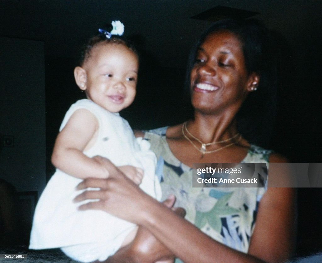 COPY SHOT Joanie Harper age 39 holds her daughter Lyndsey Michelle Harper age 2. Five members of the