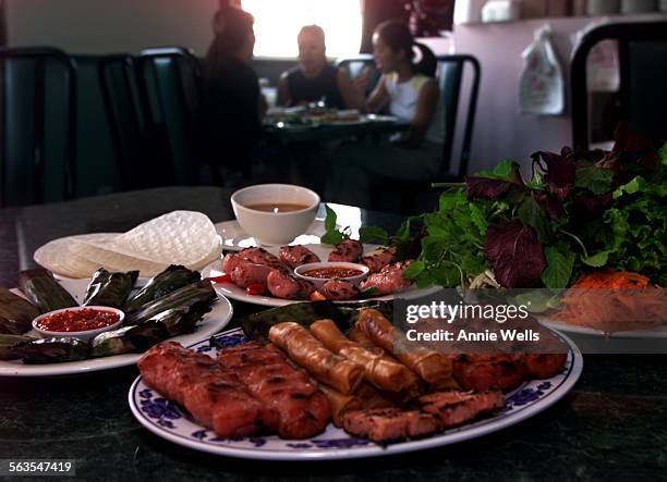 Review of Vietnamese Restaurant Nem Nuong Ninh Hoa in Rosemead. ^^^ The elements that make up Dac Biet. Plate on left has nem cab, grilled...