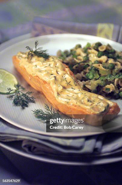 Abby.Salmon  Poached salmon filets in mustard seed broth; pasta salad with peas, cucumbers, romaigne lettuce and fresh mint. Plate and napkins from...