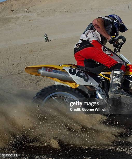 Michael Martin of Mission Viejo leans hard into a turn and kicks up dirt and dust during a recent outing at Ocotillo Wells recreation area in San...