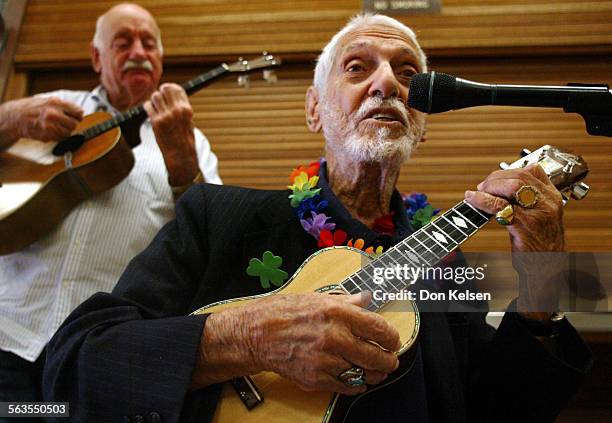 Yrold Bill Tapia performs before a gathering of ukulele players at the Oasis Senior Center in Newport Beach. Accompanying Bill, on a baritone...