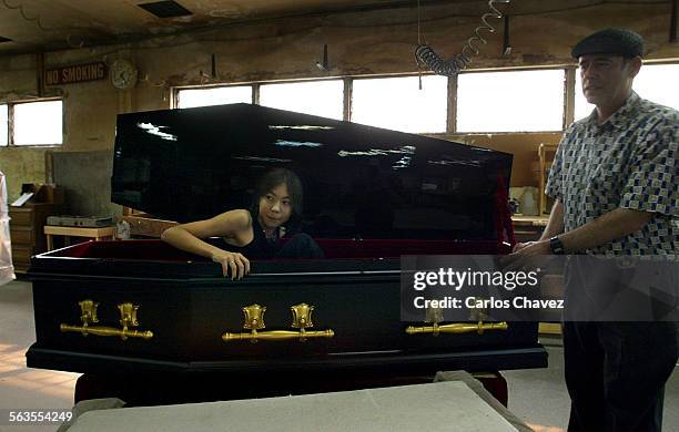Year old Naomi Okada of las Vagas, Nv,. Picked up her casket from the maker ABC Caskets in Los Angeles Tuesday. While at the factory she tried it out...
