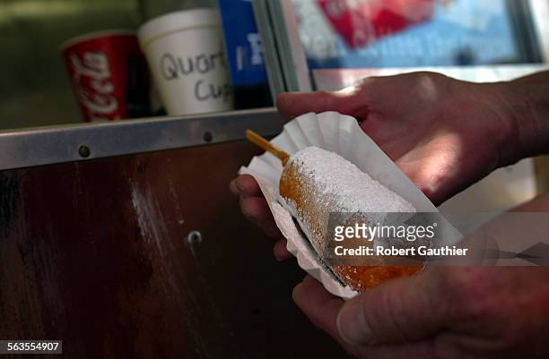 Deep fried Snickers bar is served at the Texas Donuts stand at the LA County Fair in Pomona, Friday, September 13, 2002.