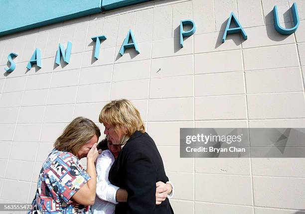 Nursing assistants Rebecca Garcia, left, and Patty Sanchez weep with Sue Houx after the closing of Santa Paula Memorial Hospital Friday. Houx was a...