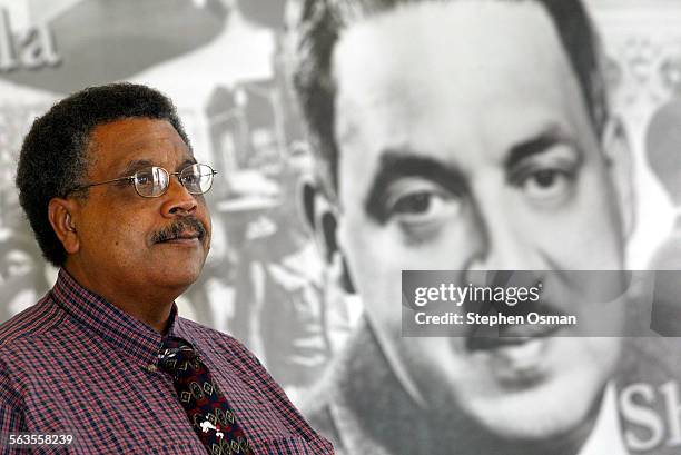 Ernie Morrison, to the left of a lobby mural of Thurgood Marshall, is the pricipal of the new Thurgood Marshall Elementary School in Oxnard which...