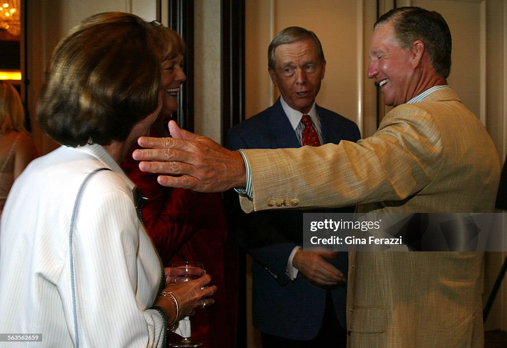 Former republican Governor Pete Wilson mingles with the owners of the Manchester Grand Hyatt, Dougla