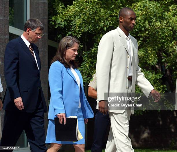 Kobe Bryant, right, leaves Eagle County Justice Center with his defense attorneys Harold Haddon and Pamela Mackey after his first court appearance in...